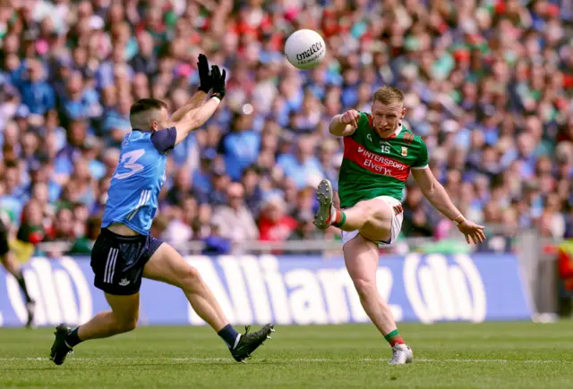 Ryan O'Donoghue kicks past Paddy Small