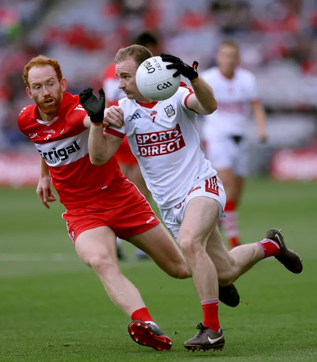 Matty Taylor is challenged by Conor Glass