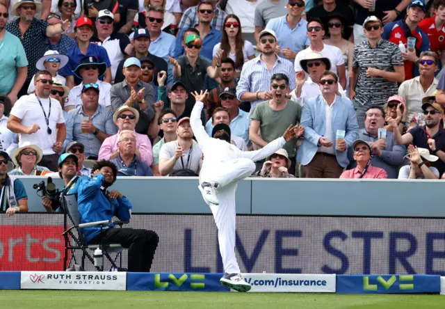 Rehan Ahmed makes a diving stop to prevent a six, with the crowd looking on aghast in the background