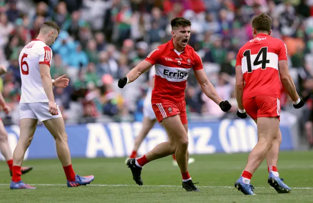 Conor Doherty celebrates after scoring a goal with Shane McGuigan