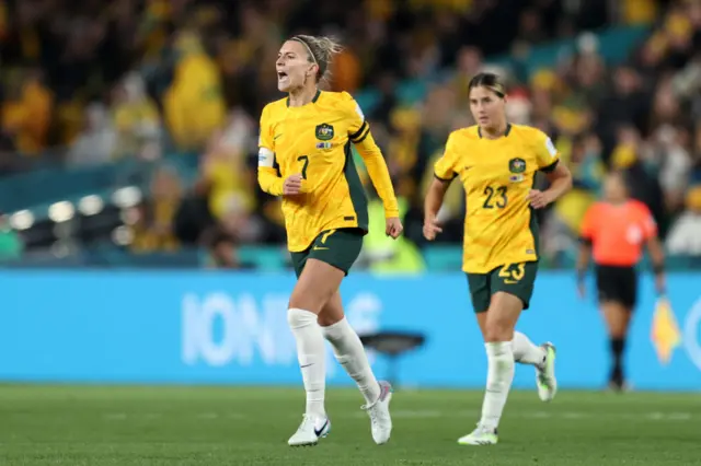 Steph Catley celebrates scoring the opening goal for the hosts.