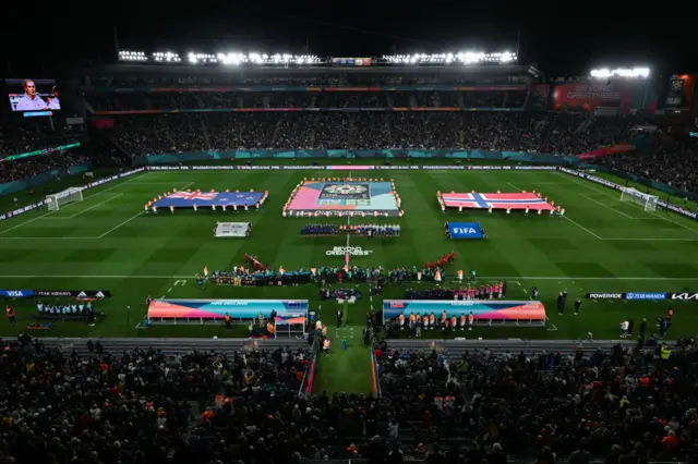 Players line up for the national anthem.