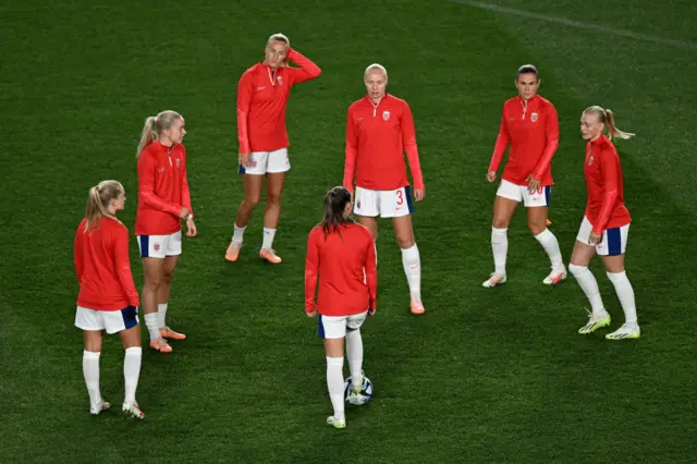 Norway players begin their warm ups ahead of the opening game.