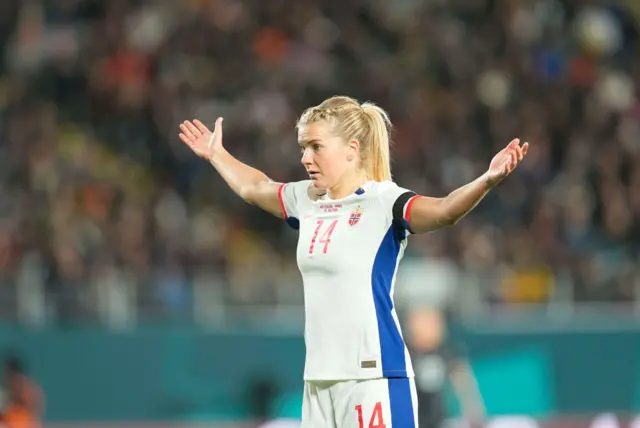 Ada Hegeberg throws her hands up in the air in frustration.