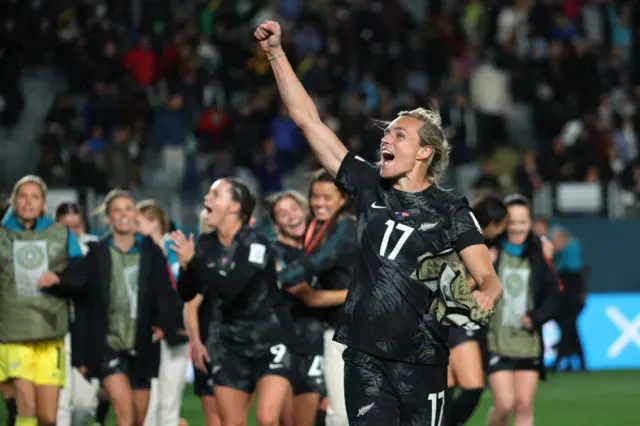 Hannah Wilkinson waves to the fans after the team's historic win.