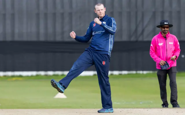 Michael Leask celebrates his wicket