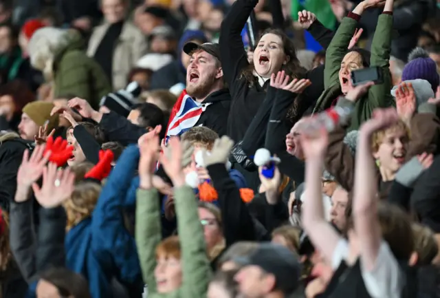 New Zealand fans cheer a last minute tackle from their side.