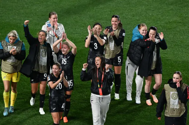 New Zealand do a lap of honour after their momentous win.