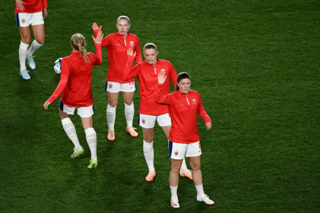 Norway players warm up ahead of the opening game.