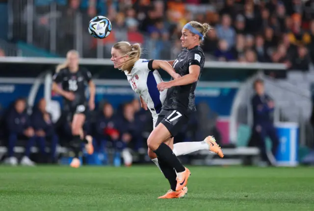 Hannah Wilkinson puts pressure on a Norway defender.