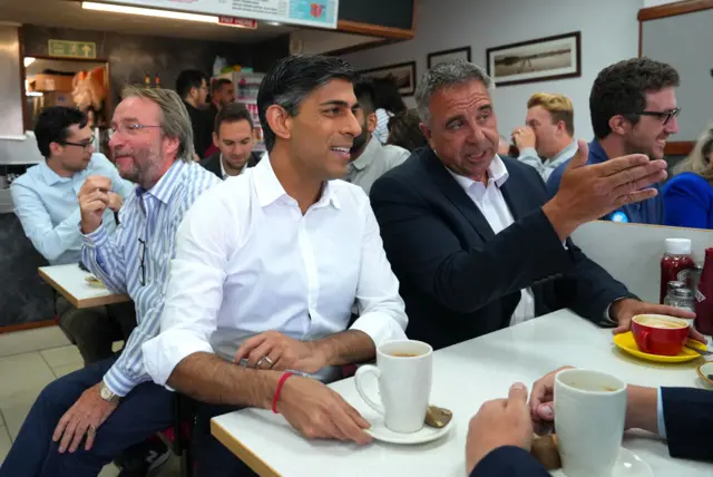 Prime Minister Rishi Sunak with newly elected Conservative MP Steve Tuckwell at the Rumbling Tum cafe in Uxbridge, north west London