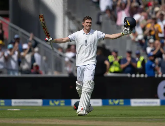Zak Crawley raising his bat after hitting a century