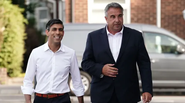 Prime Minister Rishi Sunak and newly elected Conservative MP Steve Tuckwell arriving a cafe in Uxbridge