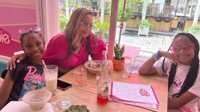 Mother and daughter Barbie fans enjoy lunch at the cafe