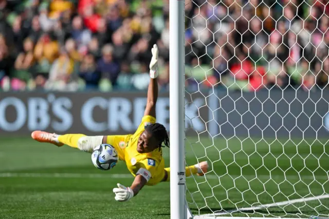 Nigeria's goalkeeper #16 Chiamaka Nnadozie saves a penalty kick by Canada's forward #12 Christine Sinclair during the Australia and New Zealand 2023 Women's World Cup Group B football match