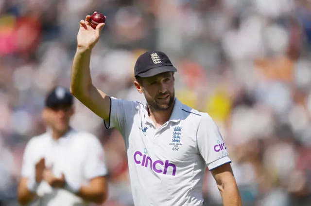 Chris Woakes holding up the ball after taking five wickets