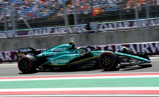 Fernando Alonso drives his Aston Martin F1 care out of the pit lane