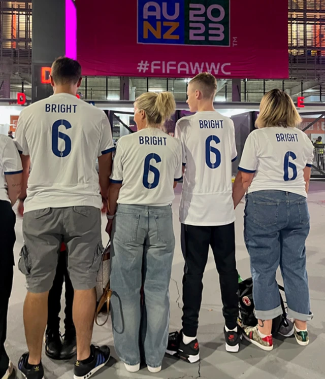 England fans show off their Bright 6 shirts ahead of kick off.