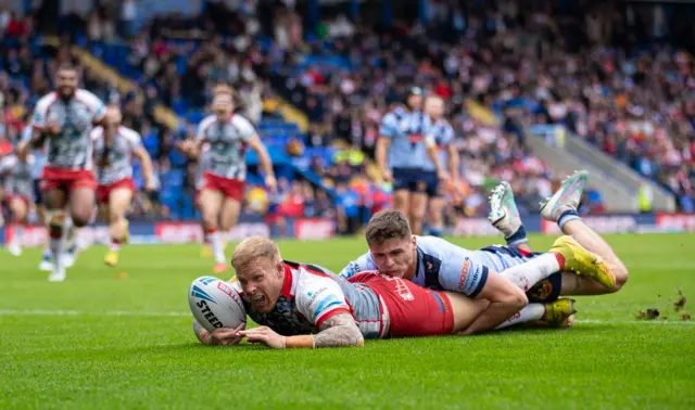 Oliver Holmes scores for Leigh against St Helens