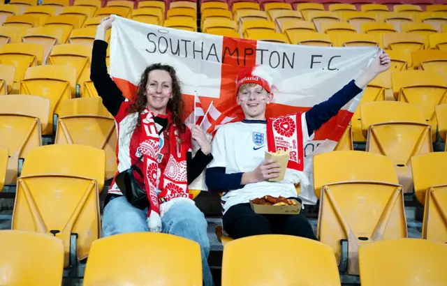 Southampton FC fans show their support for England in the stands.