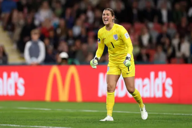 Mary Earps celebrates keeping a clean sheet with a fist pump.