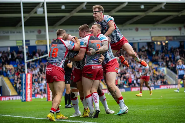 Leigh celebrate their first try against St Helens