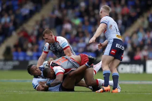 St Helens' Agnatius Paasi is tackled