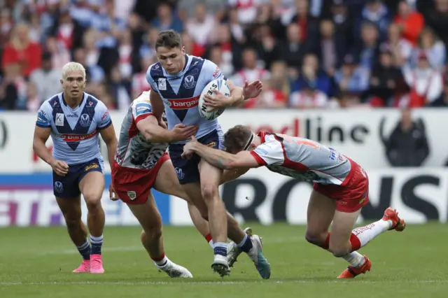 St Helens' Jack Welsby is tackled