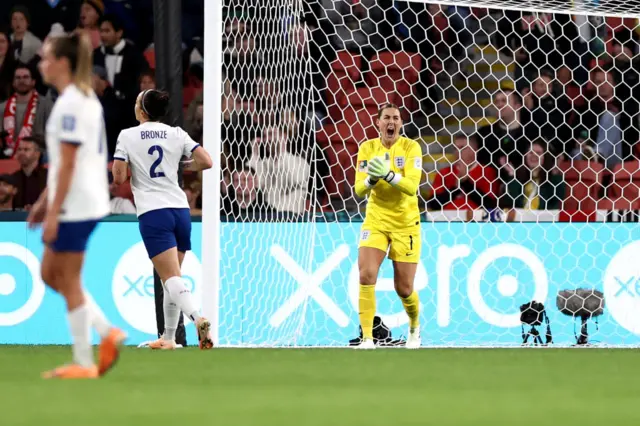 Mary Earps shouts orders at the defence after making a huge save.