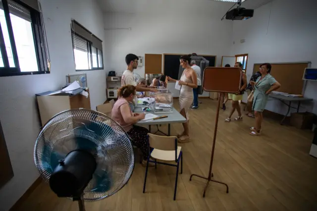 A fan at a polling station in Benidorm