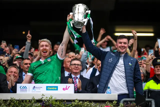 Cian Lynch and Declan Hannon raise the Liam McCarthy cup aloft following today's 9-point win over Kilkenny.