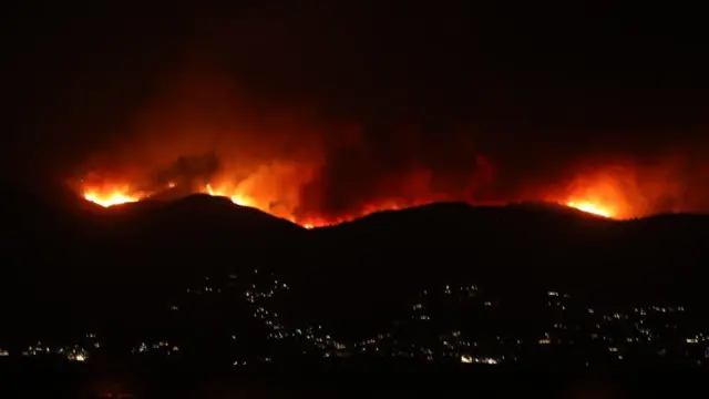 Fires burn on a hillside in Corfu