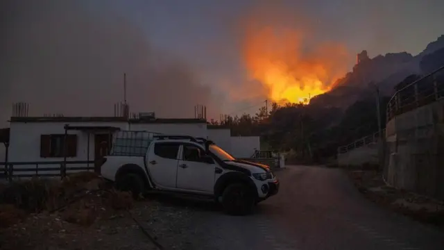 A fire burns on a hillside on Rhodes