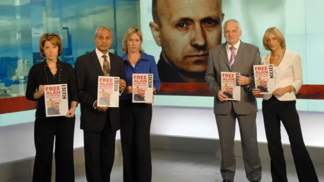 Kaplinsky, Alagiah, Raworth and fellow presenters Nik Gowing and Emily Maitlis hold signs saying "Free Alan"