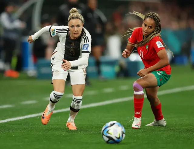 Svenja Huth of Germany and Fatima Tagnaout of Morocco compete for the ball