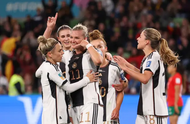 Alexandra Popp of Germany celebrates with teammates