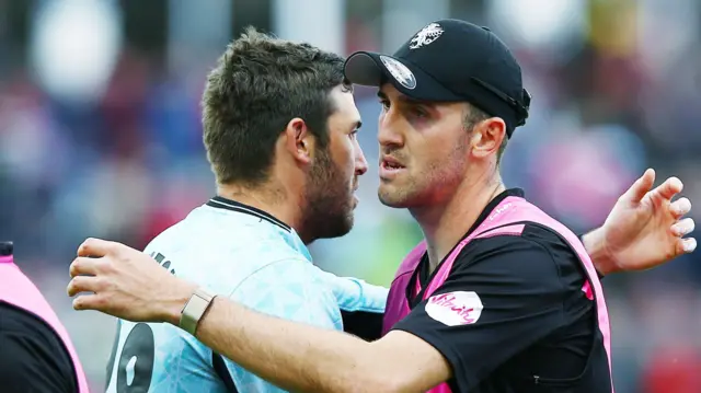 Jamie Overton (left) acknowledging brother Craig