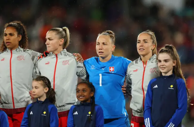 Switzerland players line up for the national anthem