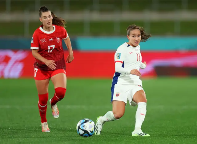 Guro Reiten of Norway controls the ball against Seraina Piubel of Switzerland