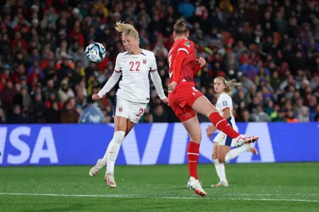 Julia Stierli of Switzerland and Sophie Roman Haug of Norway compete for the ball