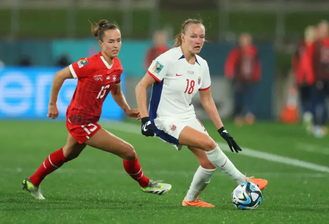 Frida Maanum of Norway controls the ball against Lia Waelti