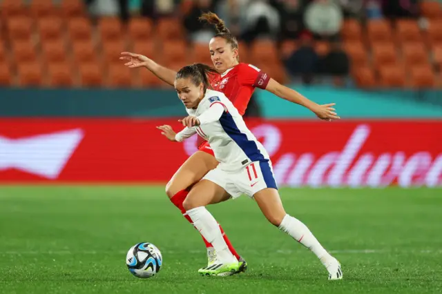 Guro Reiten of Norway controls the ball against Lia Waelti