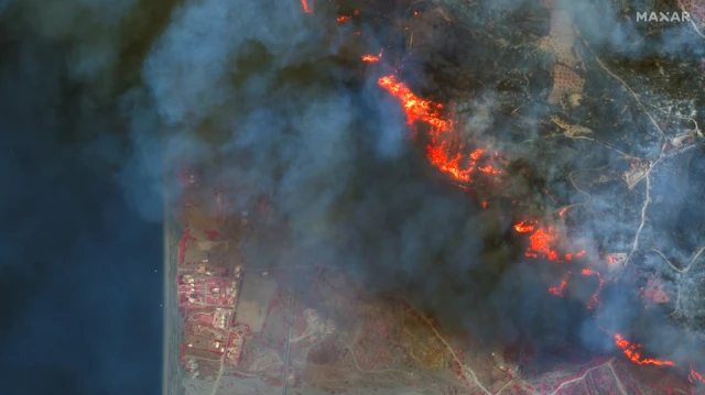 Satellite image shows colour infrared view of active fires near Gennadi and coast on Rhodes