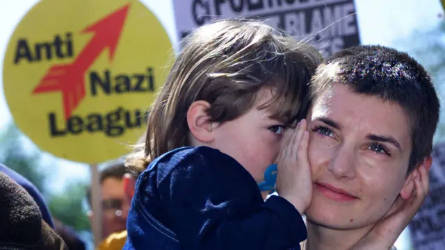 O'Connor hugs her daughter Roisin during an anti-racism demonstration in Dublin city centre in 2000