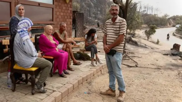 People by Adil El Selmy's restaurant in western Tunisia - July 2023