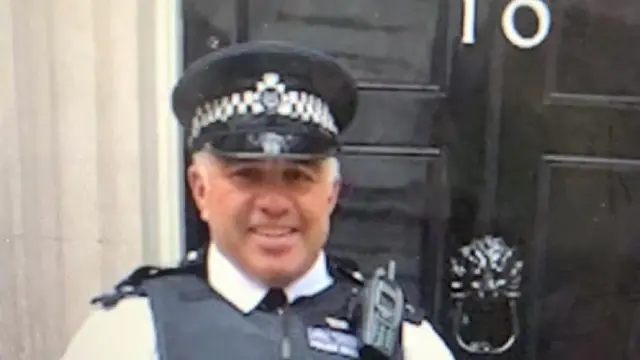 Sgt Matt Ratana stands outside the door of 10 Downing Street