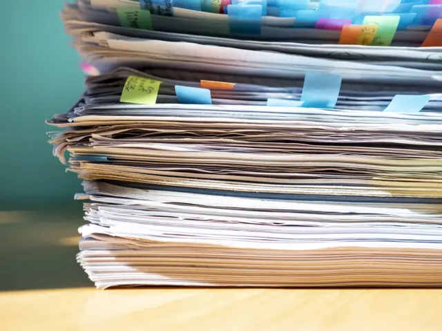 Stock image of pile of papers