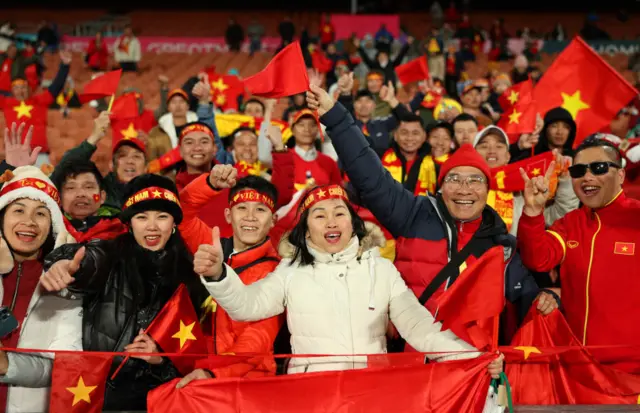 Vietnam fans cheer on their side as they emerge for the warm ups.