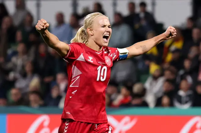 Pernille Harder shouts in delight as her side score a late winner.