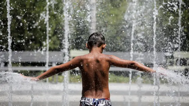 A boy cools off in Greece